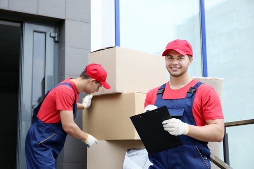 Grand piano being prepared for relocation by trained movers