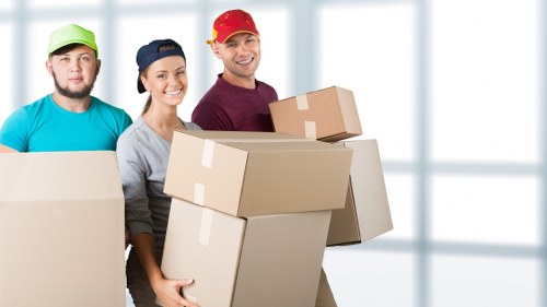 Professional movers handling items inside a Wandsworth removal van